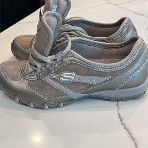 Skechers like new. Worn once size 6.5 Tan color. Rhinestones on side by the Logo